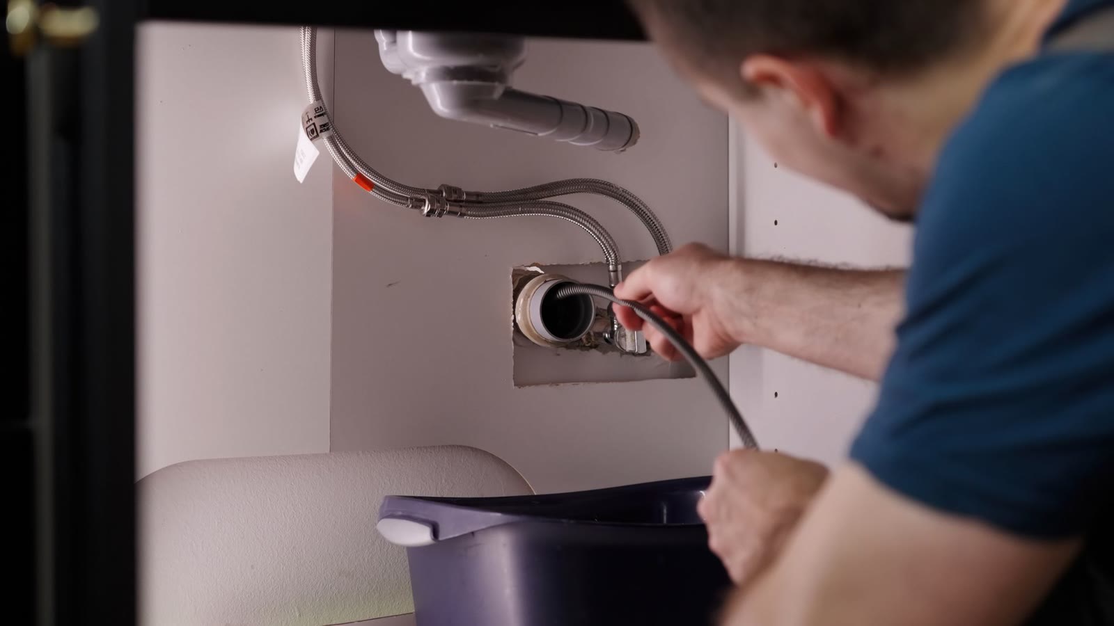 Plumber tracing a leak in an Arvada home